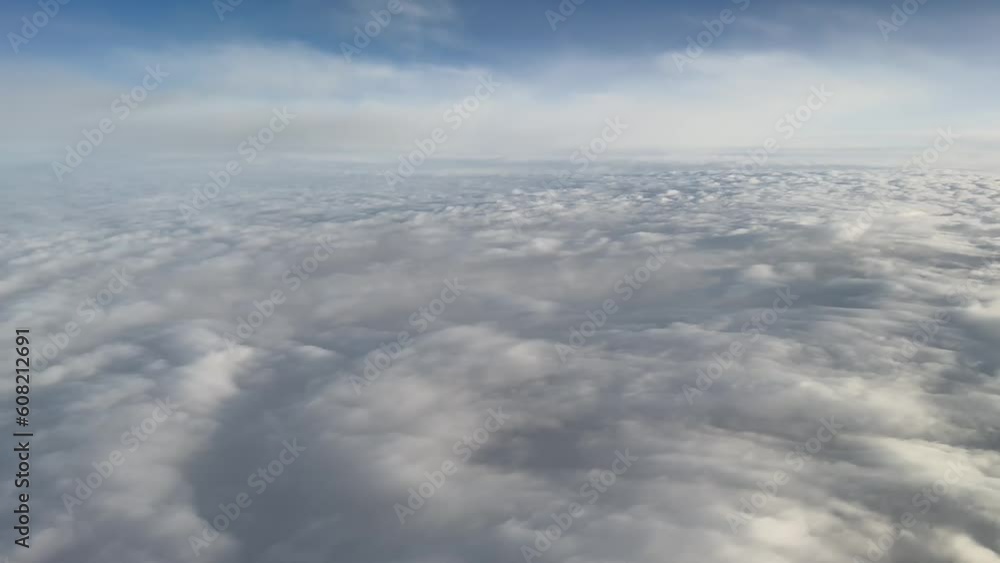 Flying over the clouds view from window plane. Traveling above the clouds. Flying over the clouds view from window plane. Traveling above the clouds.