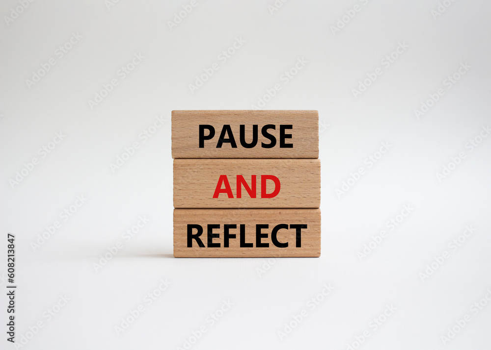 Pause and Reflect symbol. Concept words Pause and Reflect on wooden blocks. Beautiful white background. Business and Pause and Reflect concept. Copy space. Pause and Reflect symbol. Concept words Pause and Reflect on wooden blocks. Beautiful white background. Business and Pause and Reflect concept. Copy space.