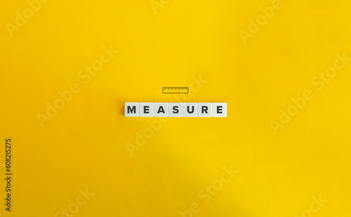 Measure Word and Concept Image. Letter Tiles on Yellow Background. Minimal Aesthetics.