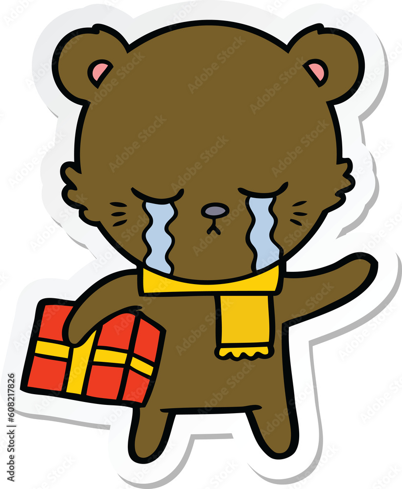 sticker of a crying cartoon bear with present