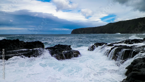 Waves crashing against rocks. Piscinas Naturais Caneiros Natural Park. © Jan