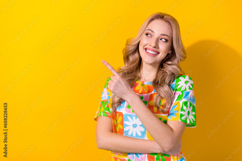 Portrait of attractive lady showing empty space sale banner travel agency agent promoter isolated yellow color background Portrait of attractive lady showing empty space sale banner travel agency agent promoter isolated yellow color background