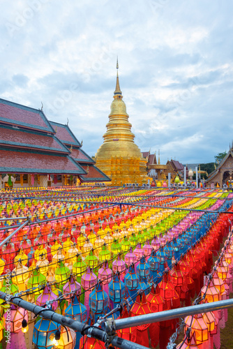 The Wat Phra That Hariphunchai pagoda with light Festival at Lamphun, Thailand. © gamjai