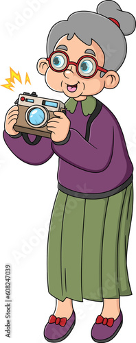 An elder woman photographer taking pictures with camera in traveling. Aged tourist with gray hair