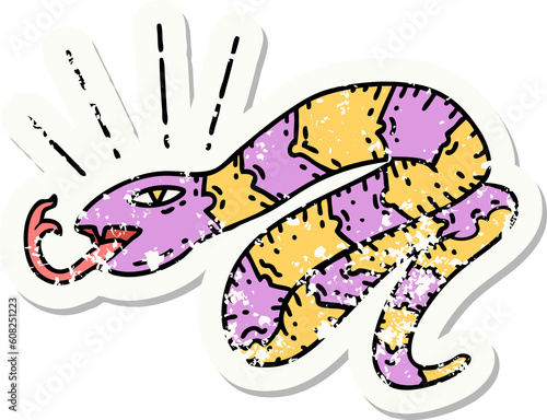 worn old sticker of a tattoo style hissing snake