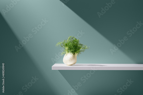 Bunch of plant in vase over slab