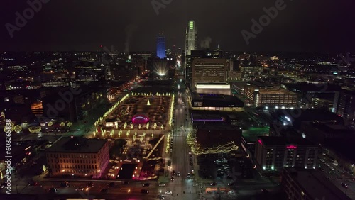 Wallpaper Mural Downtown Omaha, Nebraska Midwestern city, buildings, hotels, and offices from drone aerial shot of night life, Christmas lights, and car road traffic Torontodigital.ca