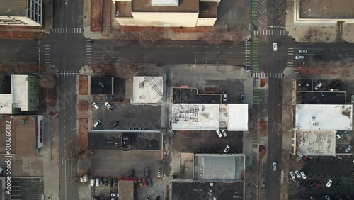 Drone shot and birds eye view of parking spaces, empty lots, and buildings at Nebraska capital city in downtown Lincoln photo