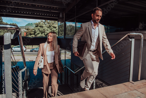 Modern business couple after a long day's work, walking together towards the comfort of their home, embodying the perfect blend of professional success and personal contentment.