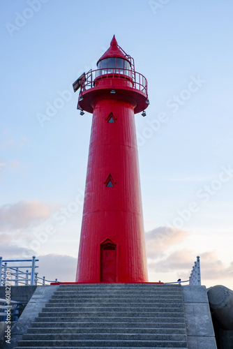 The red lighthouse. jeongok port. jeongok harbor of korea. photo