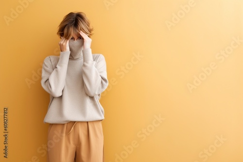 Shameful young woman covers her face with her hands. Ai generated. photo