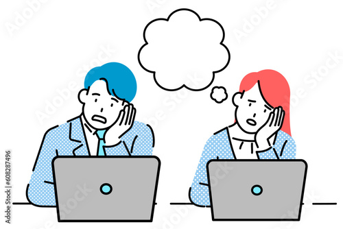 An office worker sitting in front of his laptop.