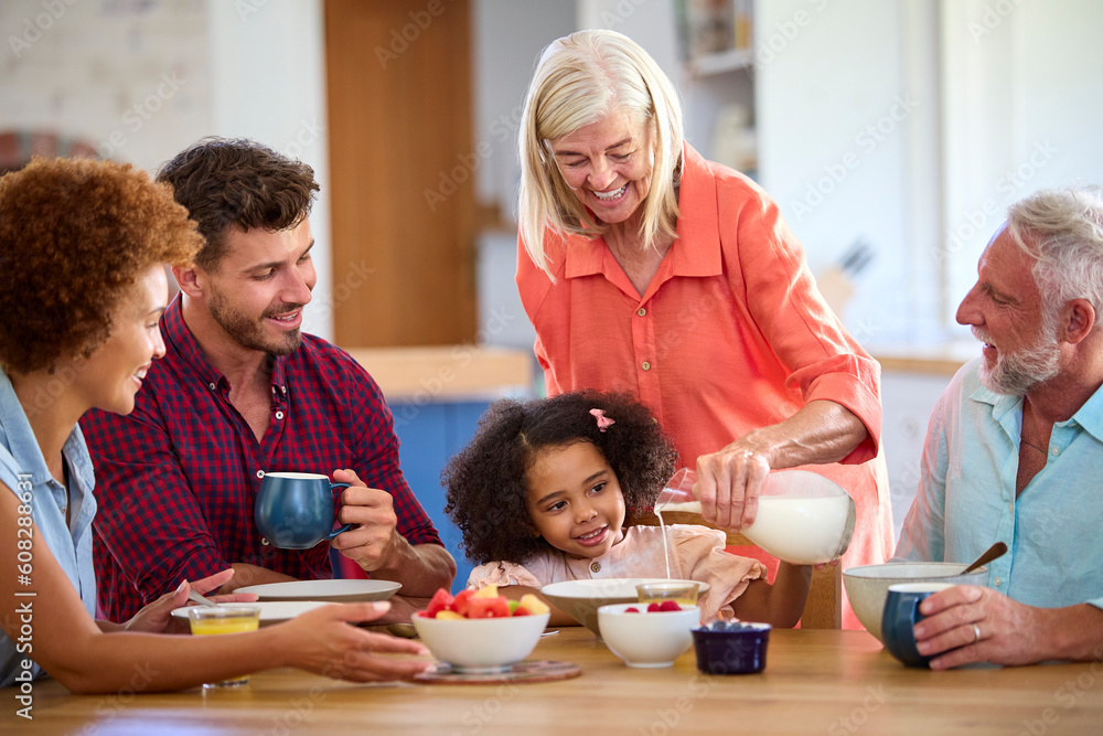 Multi-Generation Family At Home Enjoying Breakfast Together Multi-Generation Family At Home Enjoying Breakfast Together