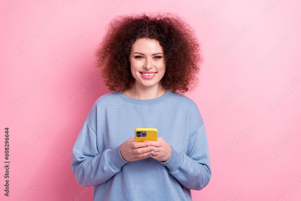 Photo of charming cute lady wear blue sweatshirt texting instagram twitter telegram facebook isolated pink color background Photo of charming cute lady wear blue sweatshirt texting instagram twitter telegram facebook isolated pink color background