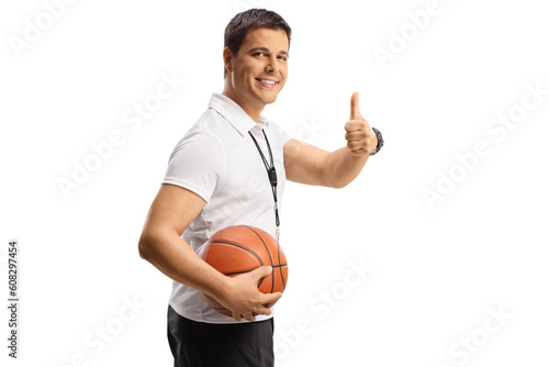 Basketball coach holding a ball and gesturing thumbs up © Ljupco Smokovski