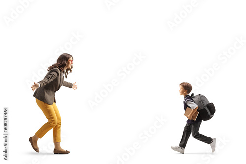 Schoolboy running to hug a young woman © Ljupco Smokovski