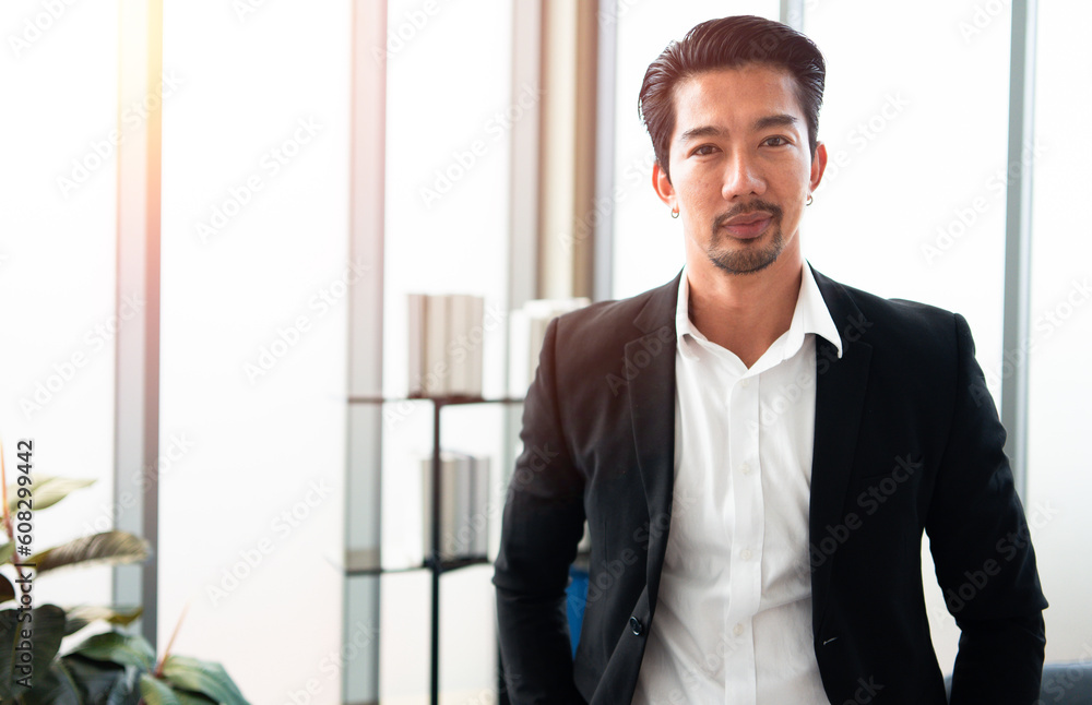 Portrait of Successful, handsome young businessman. Attractive male confident, manager, leadership in formal standing on office. Business work modern lifestyle concept. Portrait of Successful, handsome young businessman. Attractive male confident, manager, leadership in formal standing on office. Business work modern lifestyle concept.