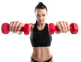 Sporty young woman training with dumbbells, pumping up muscles of hands