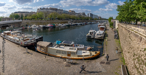 Paris, France - 05 19 2023: Canal Saint-Martin. View of boats in the Dockyard basin .