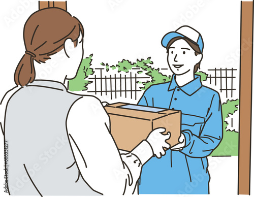 荷物を届ける作業服をきた女性ドライバー
