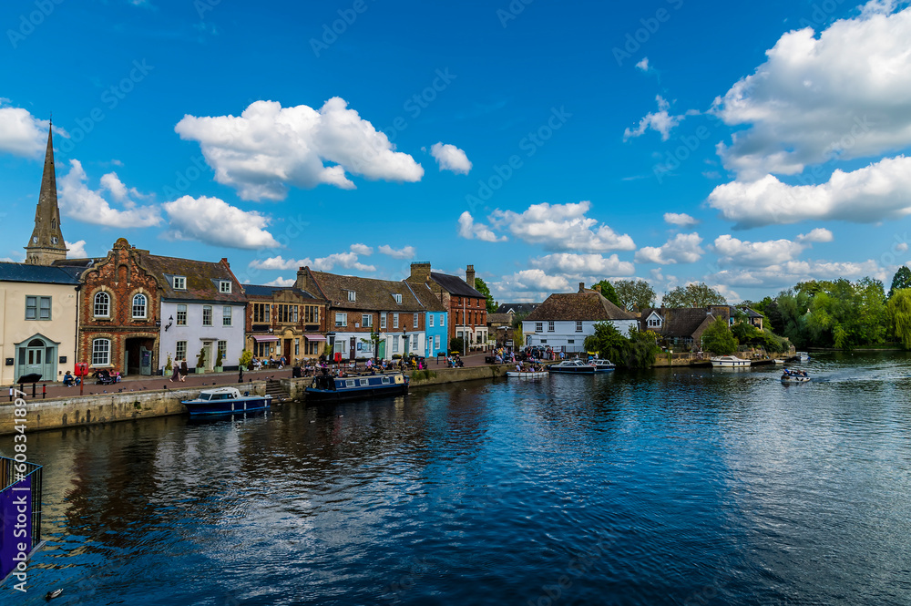A view towards the quayside of the River Great Ouse at St Ives, Cambridgeshire in summertime