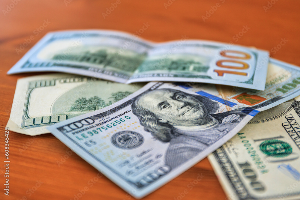100 dollar bills on the table at home 100 dollar bills on the table at home