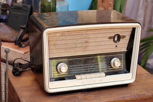 Obraz na plátně Retro broadcast radio receiver on wooden table circa 1950