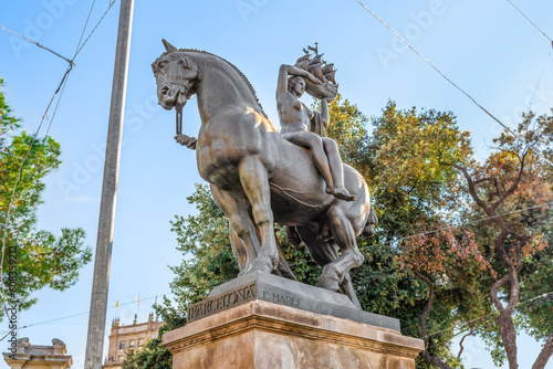 Barcelona, Spain - November 26, 2021: Equestrian statue of Barcelona by Frederic Mares in Barcelona, 1928. Sculpture of a woman sitting on a horse and holding a ship in her hands on Placa de Catalunya