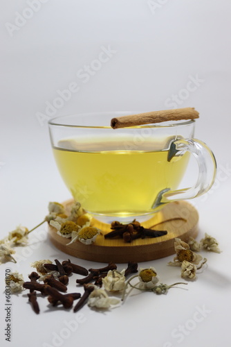 cup of green tea with cinnamon sticks