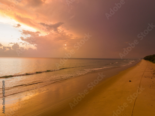 aerial view amazing cloud in colorful sky at sunset above the ocean..the sea water reflected from the sky..Majestic sunset landscape Amazing light of nature..beautiful sunset cloudscape background..
