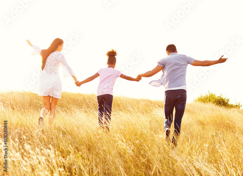 child daughter family happy mother father running active healthy carefree fun together girl walking cheerful field outdoor natur summer