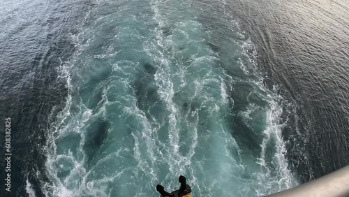 On the roof of a ferry between tropical islands, sunset photo