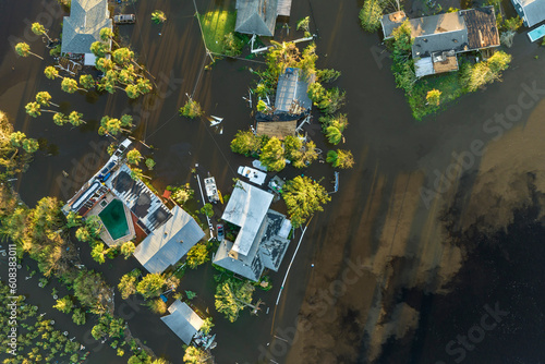 Aftermath of natural disaster. Surrounded by hurricane Ian rainfall flood waters homes in Florida residential area