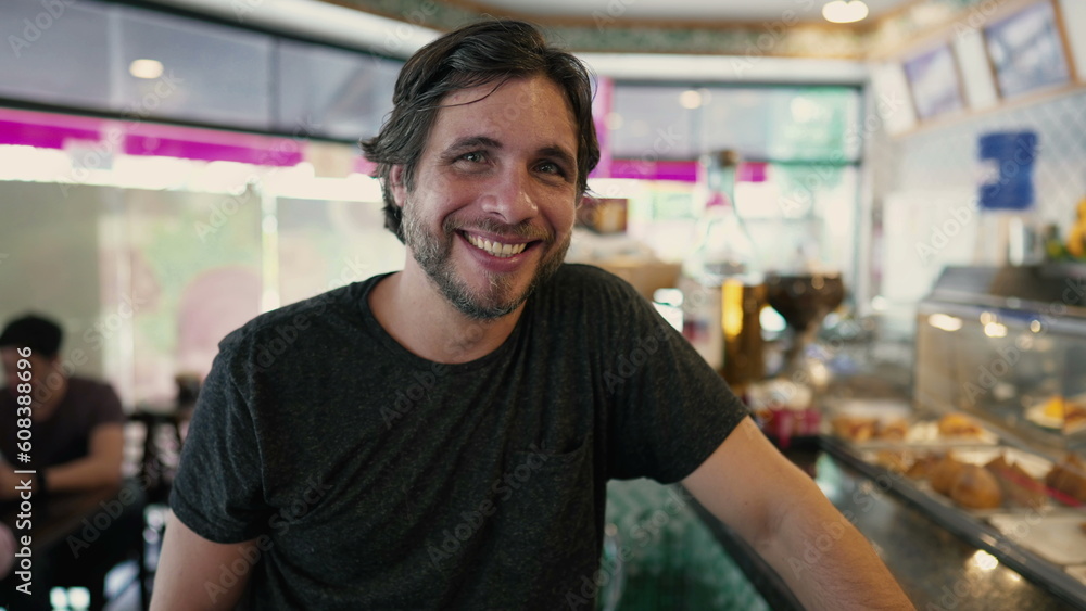 Happy young man smiling at camera. Handsome 30 male person portrait face closeup Happy young man smiling at camera. Handsome 30 male person portrait face closeup