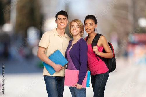 Team of happy young students outdoor