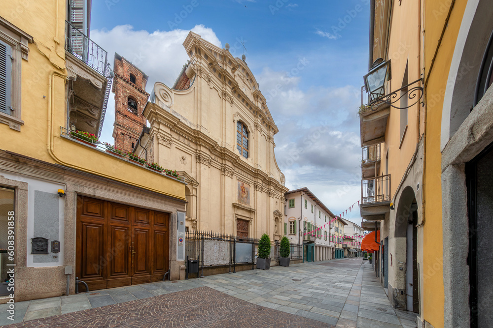 Bra, Cuneo, Piedmont, Italy -  San Antonino Martire parish church on Via Vittorio Emanuele II, main pedestrian street paved with stone slabs