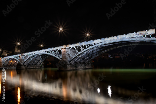 Triana bridge illuminated at night 