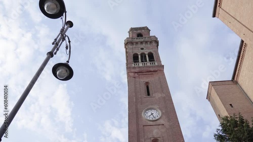 Ancient clock tower with clouds in the background