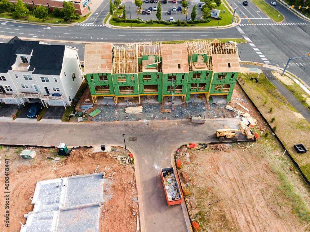 Construction site in a small American town. Apartment building under construction top view.