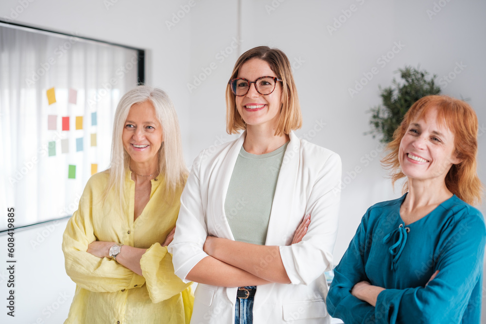 Obraz premium Group of businesswomen in corporate photo after a meeting. Concept: business, success, empowerment