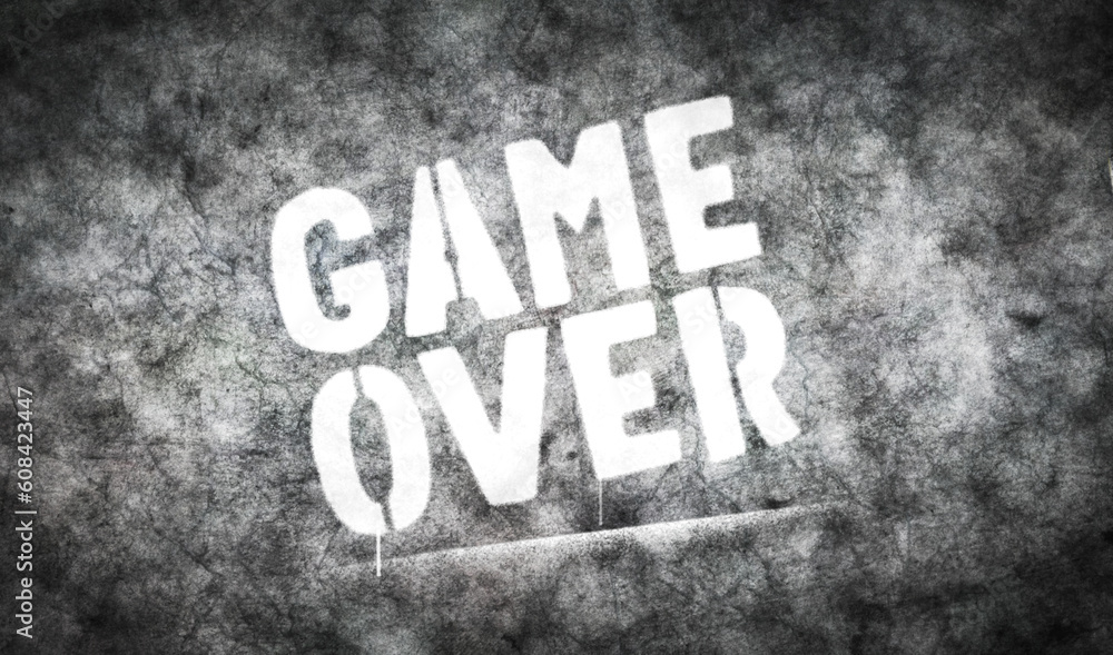 Game over sign spray painted on the concrete wall Game over sign spray painted on the concrete wall