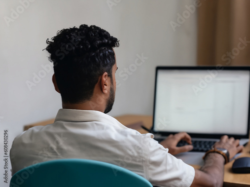 Business Man Working on Laptop at Desk - Business and Technology Concept