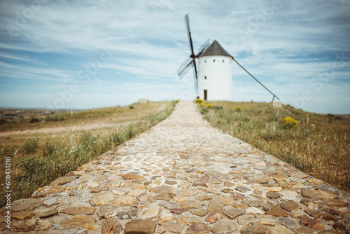 Footpath leading to a traditional whitewashed windmill, Don Quixote's Windmills (Molinos de Viento de Consuegra) Consuegra, Toledo, Castilla la Mancha, Spain photo