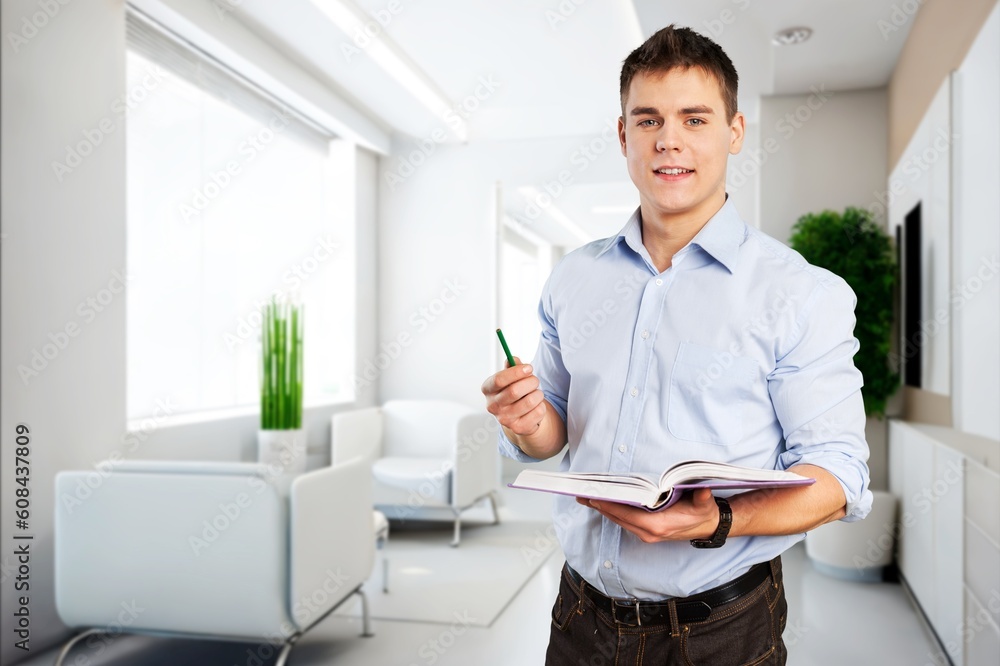 Young happy business man worker at office