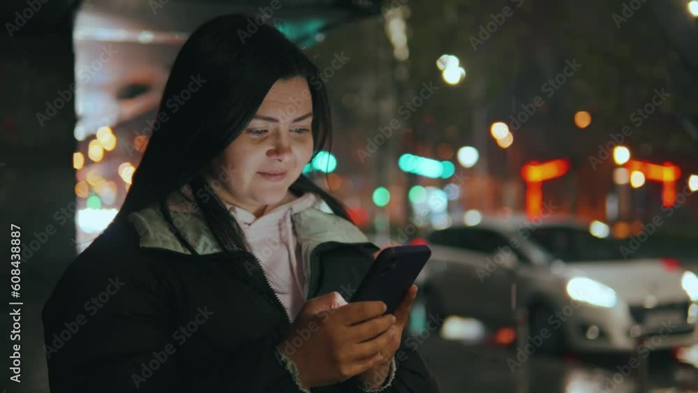 Portrait of a girl on the street with a phone in the bokeh of blurry lights. Portrait of a girl on the street with a phone in the bokeh of blurry lights.