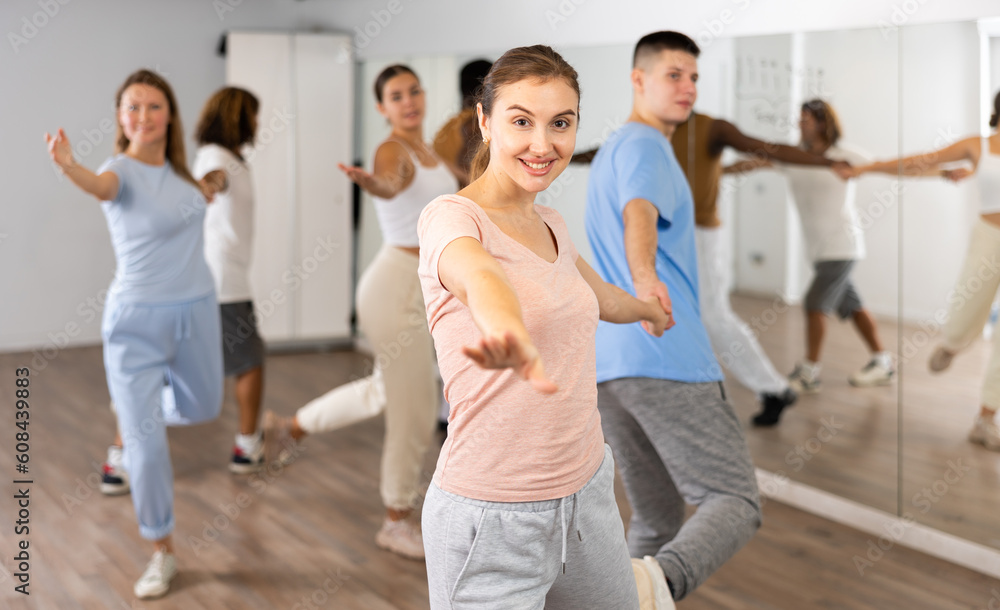 Fototapeta premium Young girl and teen boy dancing pair dance in dance hall