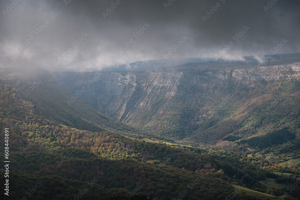 mountain landscape between clouds of the Gorobel or Sierra salvada mountains near the waterfall of Salto del Nervion, near Delika and Orduña