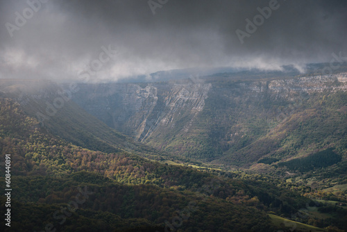 mountain landscape between clouds of the Gorobel or Sierra salvada mountains near the waterfall of Salto del Nervion, near Delika and Orduña photo