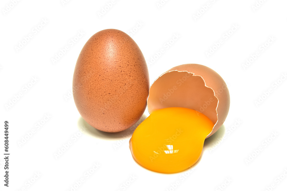 Eggs. Fresh brown chicken and egg yolk. laying on a white background Eggs. Fresh brown chicken and egg yolk. laying on a white background