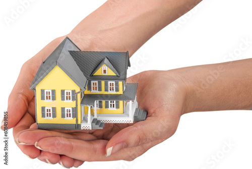 hand holding a miniature house model